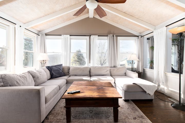 TV/Family Room with 60" TV - enters in to dining room and side patio with outdoor fireplace and swim spa hot tub that seats 11.