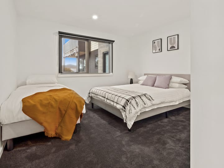 Third bedroom consists of 1 x Queen 1 x Single with built in wardrobe.