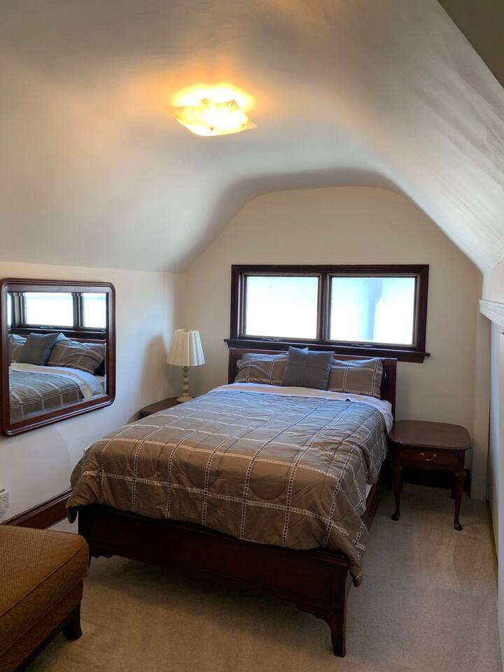 Room #5 located on the 3rd floor with a shared living room area & bathroom with Room #6