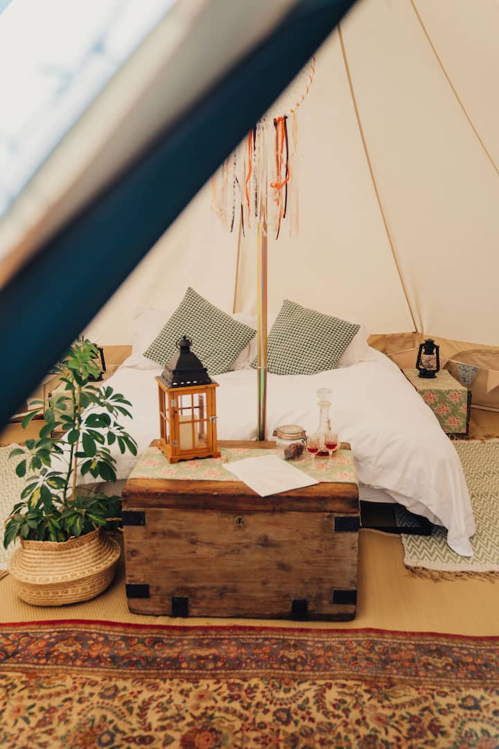 Your comfortable king size bed inside the 5 metre bell tent