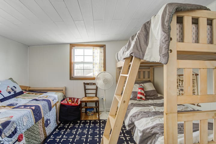 The bunk room features two twin bunks plus a twin bed that has a pop up trundle to make a king or 2 singles.  There is also a portable baby crib that can fit in this room as well.  