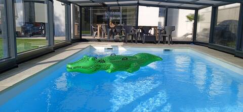 House with a swimming pool near the beach