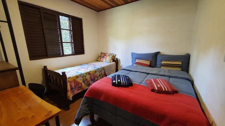 Dorm with two beds: a double and a single one.