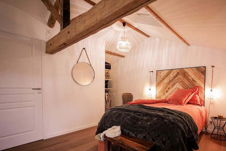 Welcome to the elegant Bedroom 2 with its custom-made headboard, original oak beams and dressing room.