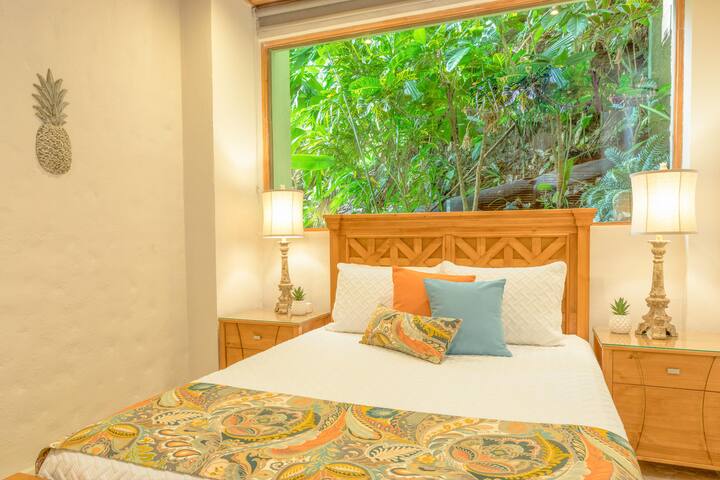 Jungle Suite (Bedroom #5) with Queen bed, attached private bath, giant jungle window