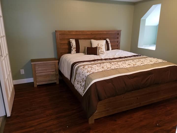 King bed- off the sitting room with private bathroom and soaker tub and shower.