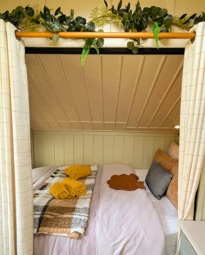 The cosy bed with curtains for a peaceful nights sleep and an orthopeadic mattress for comforting rest