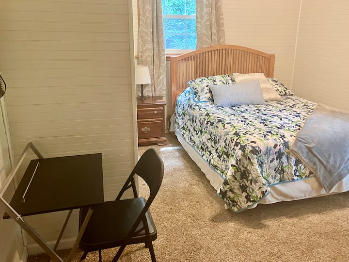 Second guest room with a Queen Bed and cozy quilts also features a ceiling fan and desk workspace.