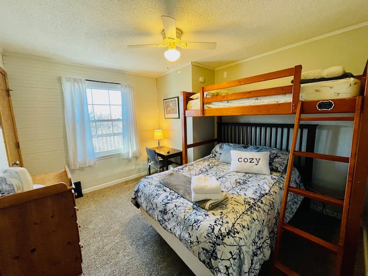 The Third Bedroom features a twin loft bed over a full bed and plenty of storage with closet and chest.  Designated work area with desk and fast fiber internet make this a great workspace. 