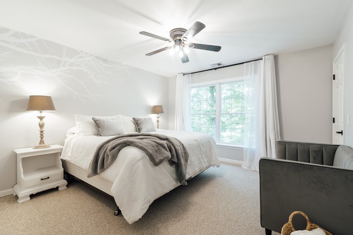 Nestled in the treetops with gorgeous views of the pond, all three bedrooms have sheers and blackout curtains to set the right tone for your sleep. 