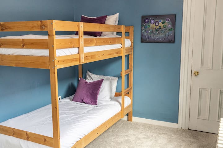 Find this twin-sized bunk bed and a toddler daybed in the room off the second-floor hall. It’s a room to spark the imagination of the young, whatever the age.  