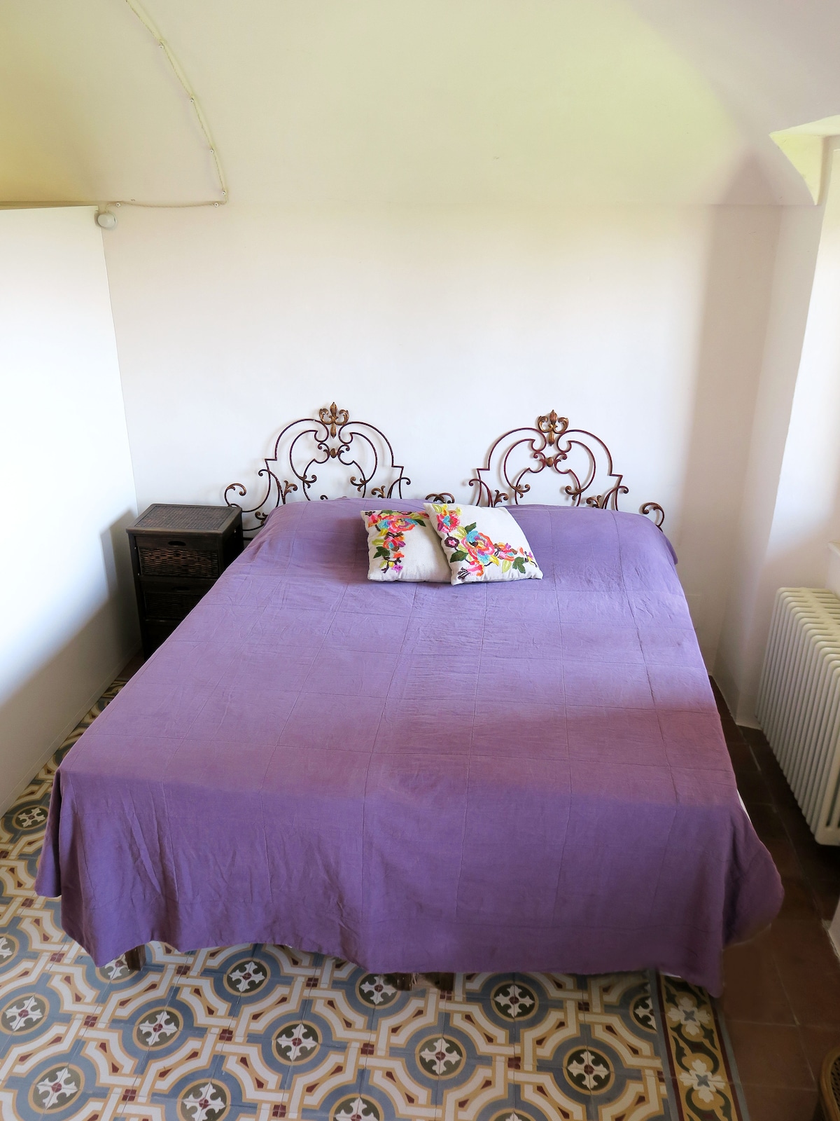 Violet bedroom for either twin or double use with access to attic room. Views over inner gardens & hills