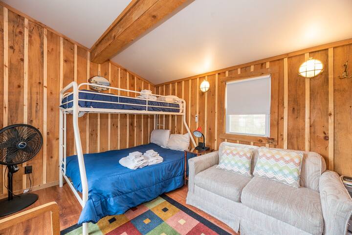 Twin over Full Bunk Bed with fan and love seat in the Bunk house