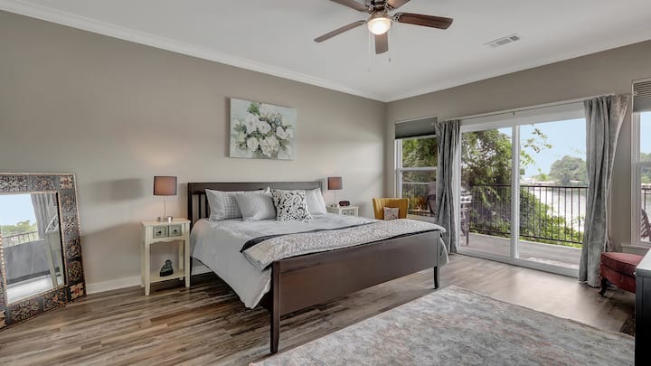 Primary bedroom with access to private balcony