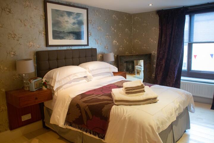 Bedroom three
Double bed with digital radio, wardrobe and en-suite bathroom. Painted wood floors and antique detailing
Artwork: Clare Money

Photo: Sharon Harrison Photography