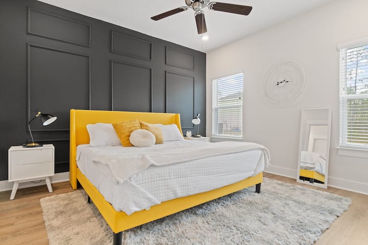 The spacious master bedroom includes a smart tv and additional dressers for an ample amount of storage during your stay. 