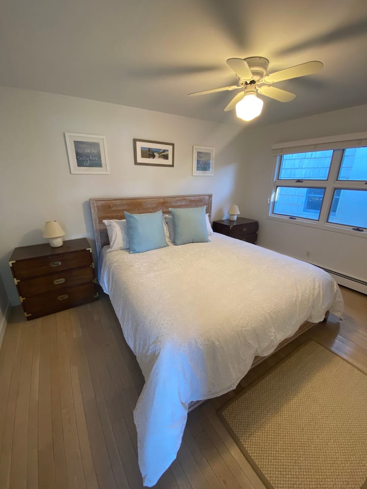 Bedroom 2 (Main House) with King Bed and bathroom next door.