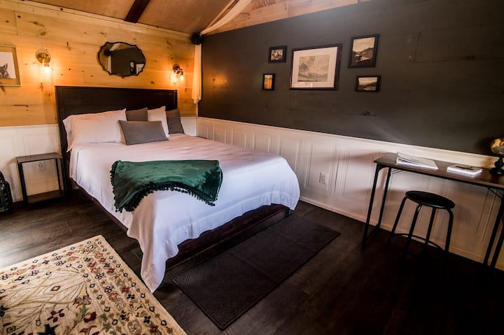 Queen bed with dimmable wall sconces. Fresh Linens are provided.