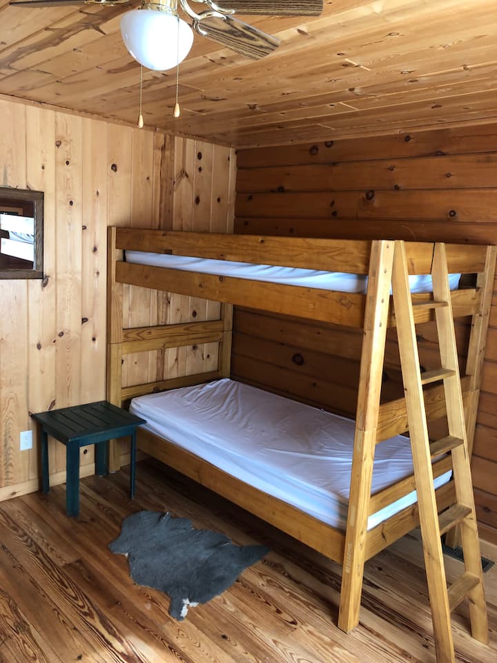 Boys twin bunk room with mirror and ceiling fan. Bring your own twin sheets and blankets and pillows