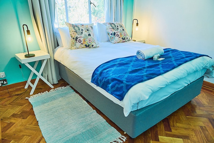 Turquoise room with joining bathroom