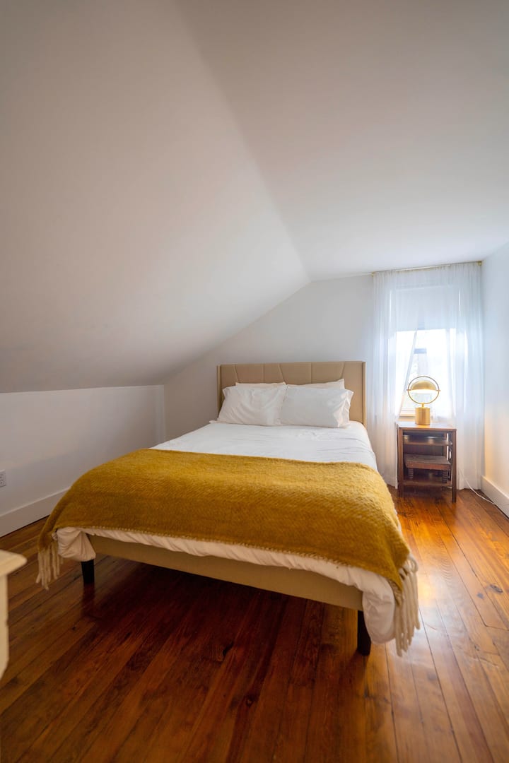 Bedroom 1 *please notice slanted ceilings due to the historic architecture of the house*