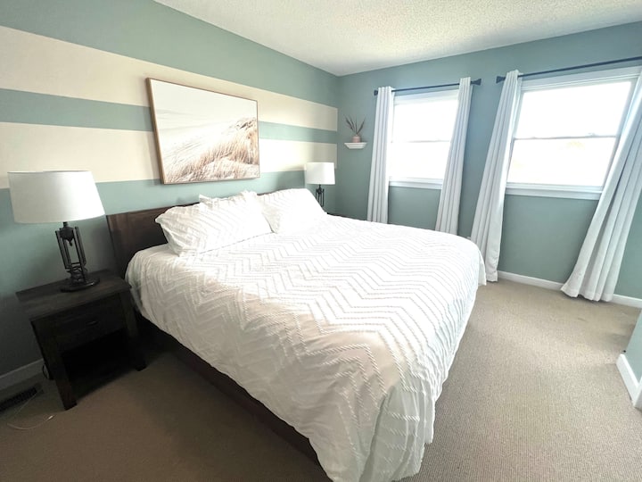 Master Bedroom has a king size bed.