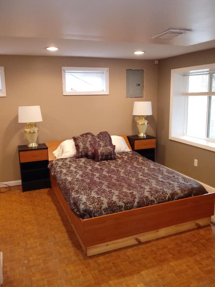 This queen bed is in the ensuite area of the unit. Another bedroom with a full size bed is off the kitchenette area.