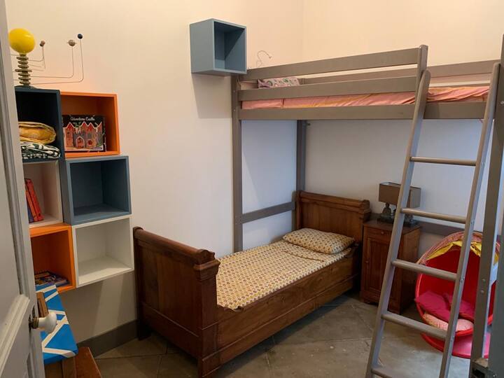 Bedroom 3. 
Two single beds and small office.