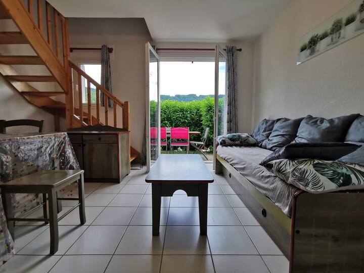 Overall view of the living room with sofa that can be used for two beds