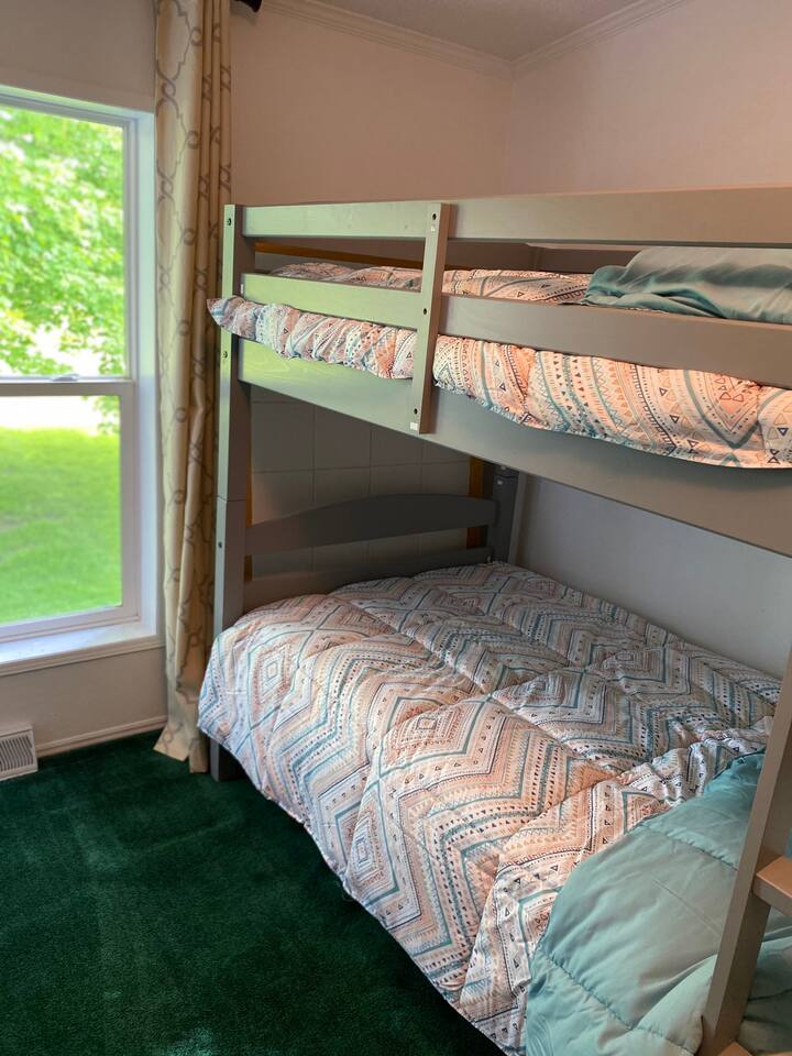 Bunk room with 4 twin beds. Brand new beds, bedding, and mattresses!