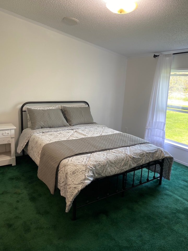 Master bedroom with queen bed with brand new mattress and attached bath. 