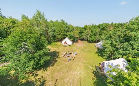 ‘Fire Circle Camp' bell tents hidden in the woods