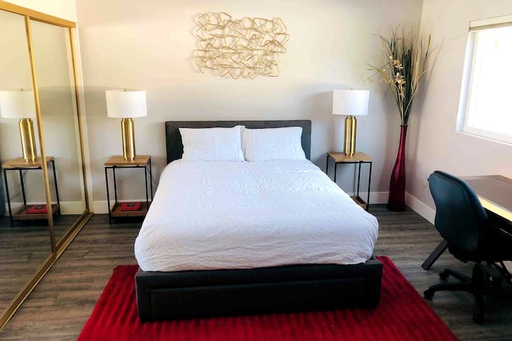 Master bath #1 with a queen bed, computer desk, and futon.