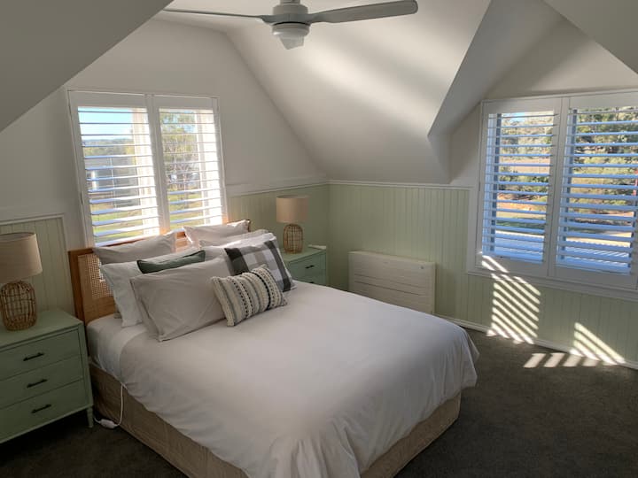 A lovely sunny bedroom. This bedroom has a queen bed and 2 king singles, making it ideal for a family. All the beds have electric blankets for your comfort. A workstation/desk is also in this room