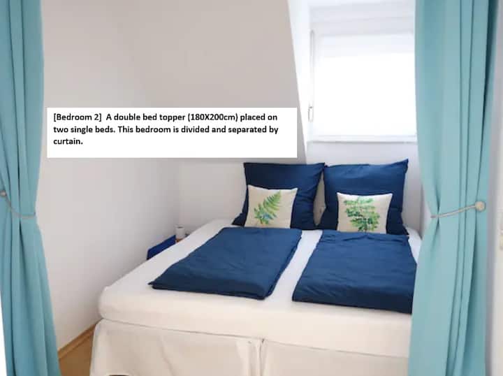 [Bedroom 2]  A double bed topper (180X200cm) placed on two single beds. This bedroom is divided and separated by curtain.