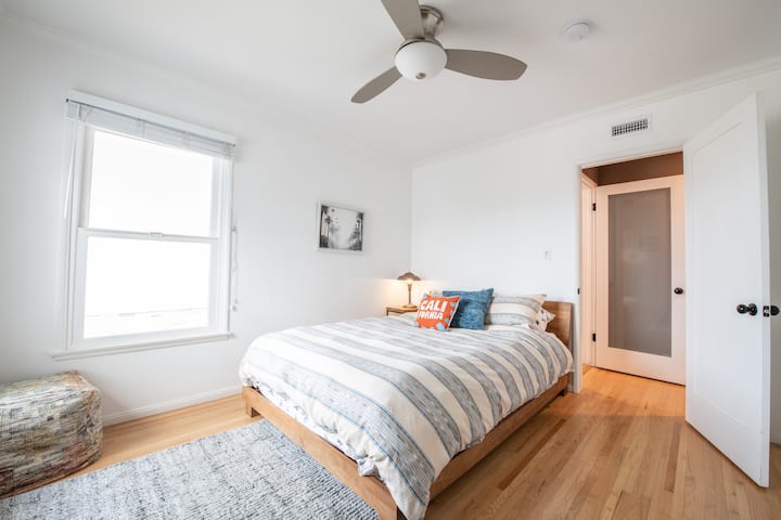 The Secondary Bedroom is complete with a queen size bed and en-suite closet and dresser with luggage racks and hangers available for you to use. 