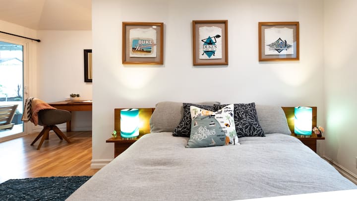 The Primary Bedroom is nestled into the back of the house with direct access to the backyard and a private desk for office calls and meetings. 