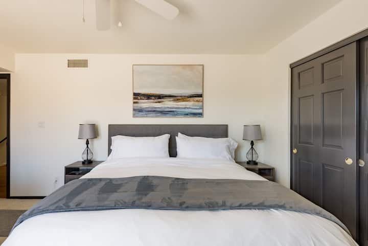 Upstairs bedroom #2 - King bed with comfy couch that turns into a full bed.   Also has a work station- desk and chair, and a large closet.  Double doors open out to a shared deck with the next bedroom.  Shares upstairs bathroom with third bedroom.  