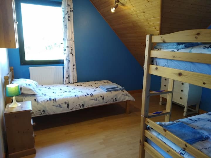 First floor children's room with bunk beds and a single bed
