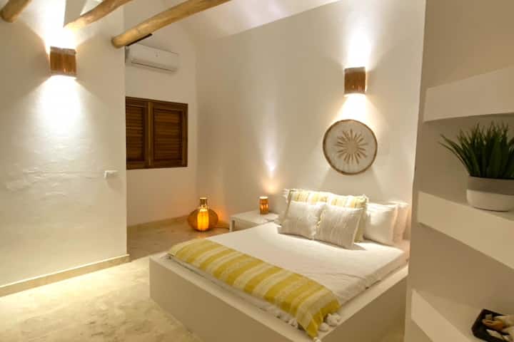 Soaring ceilings with ceiling fan.