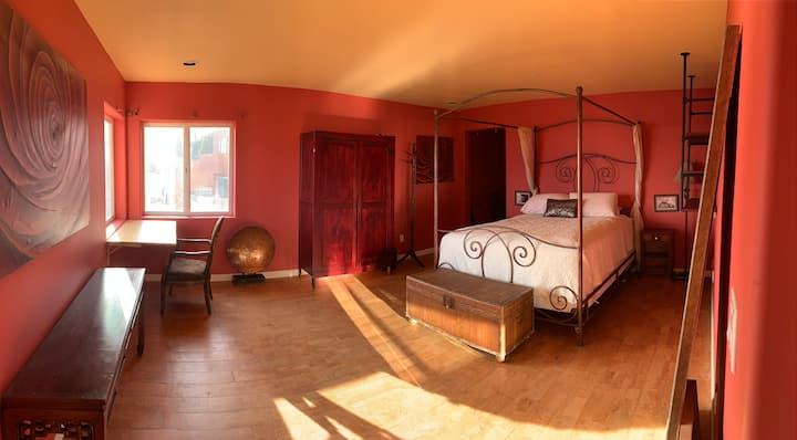 This is the master bedroom with attached bathroom. The room like caves in Santorini is cool and filled with natural light during the day. Heavy curtains are being added for great sleep.  The bed is made with Egyptian cotton and eco-pillows. 