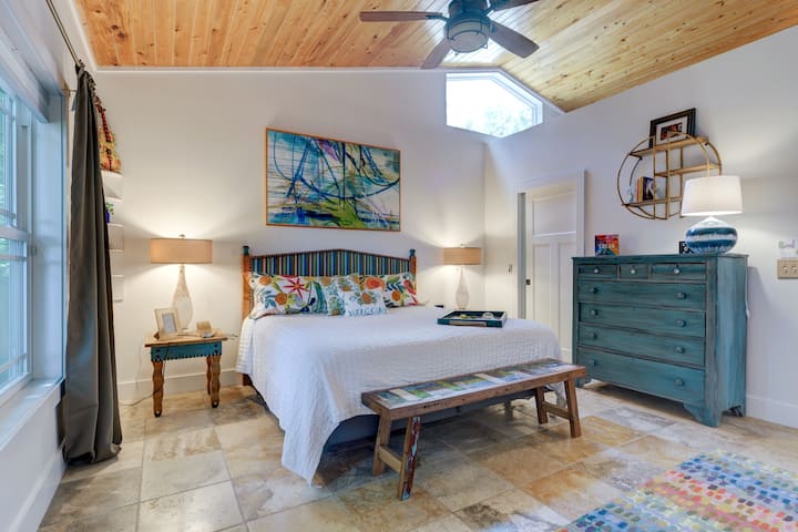 Primary Suite with King bed and side tables, handmade by Shoestring Creations.  

Behind that door is a large walk-in closet that doubles as a closet and a 'cloffice'! Comes complete with a desk, office chair, and a monitor.