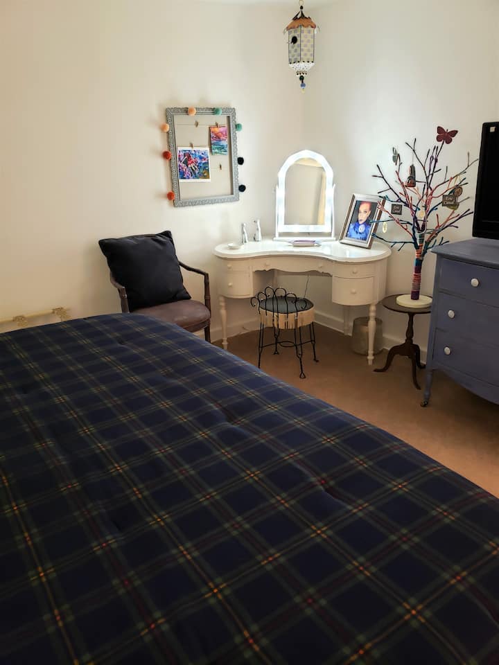 2nd Bedroom is large with King Size Adjustable Bed with flannel bedding for the winter season.  Warm and cozy with your own makeup table and lighted mirror to get ready to go out on the town. 