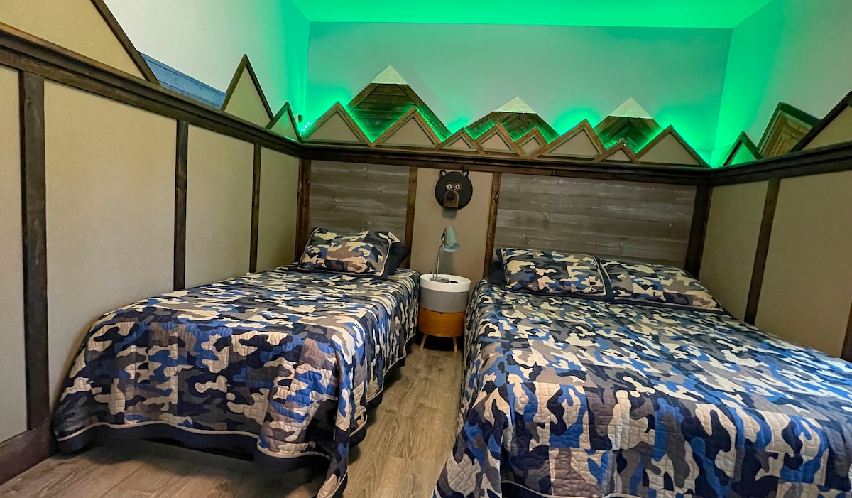 Mountain room with color changing LED lights. 
Twin bed and queen bed