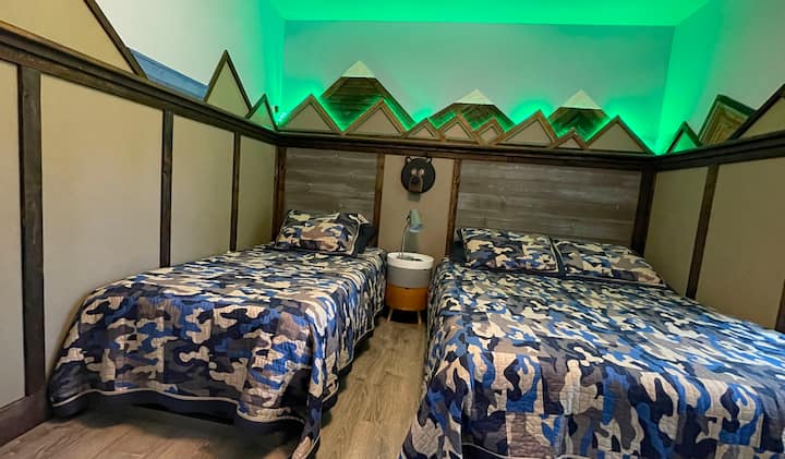 Mountain room with color changing LED lights. 
Twin bed and queen bed