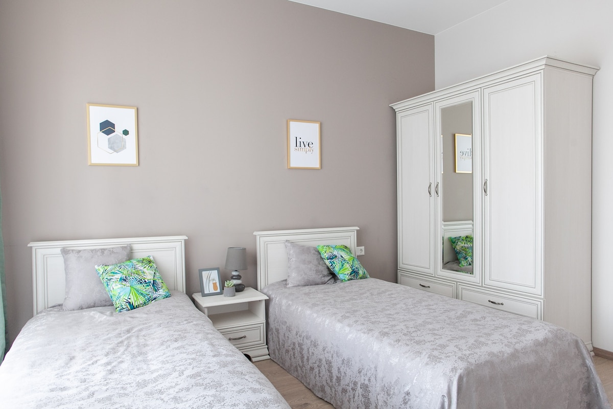 Bedroom with 2 single beds with high quality bed linen. Access to a balcony