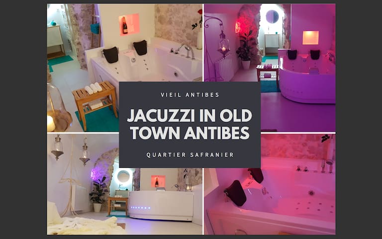 A relaxing space features a double balneo bathtub, complemented by ambient lighting in soft colors. Nearby, a wooden table offers towels, and a shower area is present, providing a blend of comfort and luxury in a soothing environment.