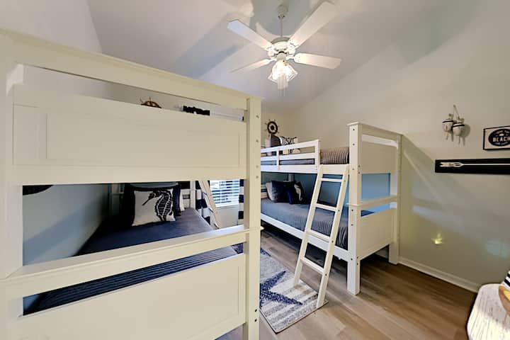 The two twin bunk beds are perfect for kids and adults alike. New comfortable mattresses and bedding in a neutral nautical decor make this a fun room to stay in. There is a nice sized walk-in closet with a luggage rack, hamper, shelving and hangers.