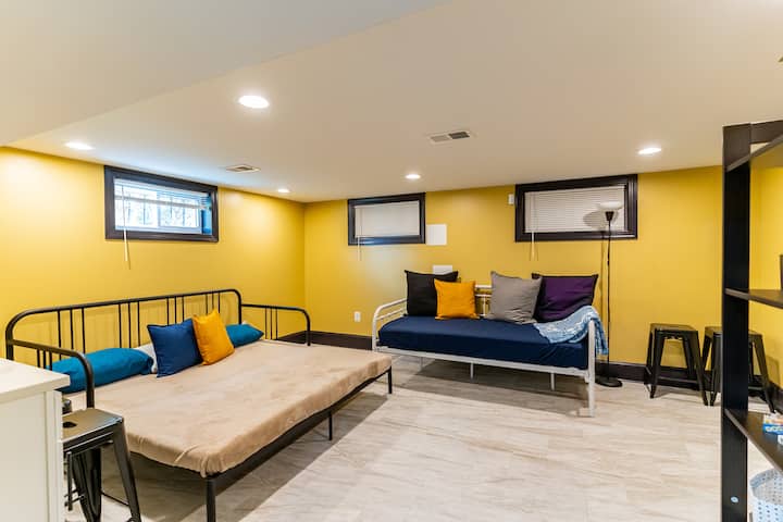 Living room 2 (basement) - equipped with 1 Pull-Out Sofa/Daybed (sleeps 2 adults), 1 daybed (sleeps 1 adult), and a 50-inch Roku TV. The Daybed can be used as a single bed or lift and pull out the extra bed base to create a large roomy double-bed.