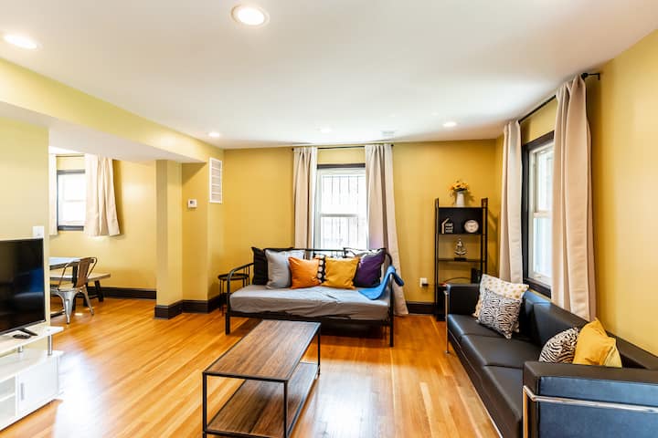 Living room 1 - equipped with 1 Pull-Out Sofa/Daybed (sleeps 2 adults), 1 Portable Single bed (sleeps 1 adult), and a 55-inch Roku TV. The Daybed can be used as a single bed or lift and pull out the extra bed base to create a large roomy double-bed.